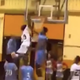 Melvin Lee dunks over two defenders.
YouTube screenshot